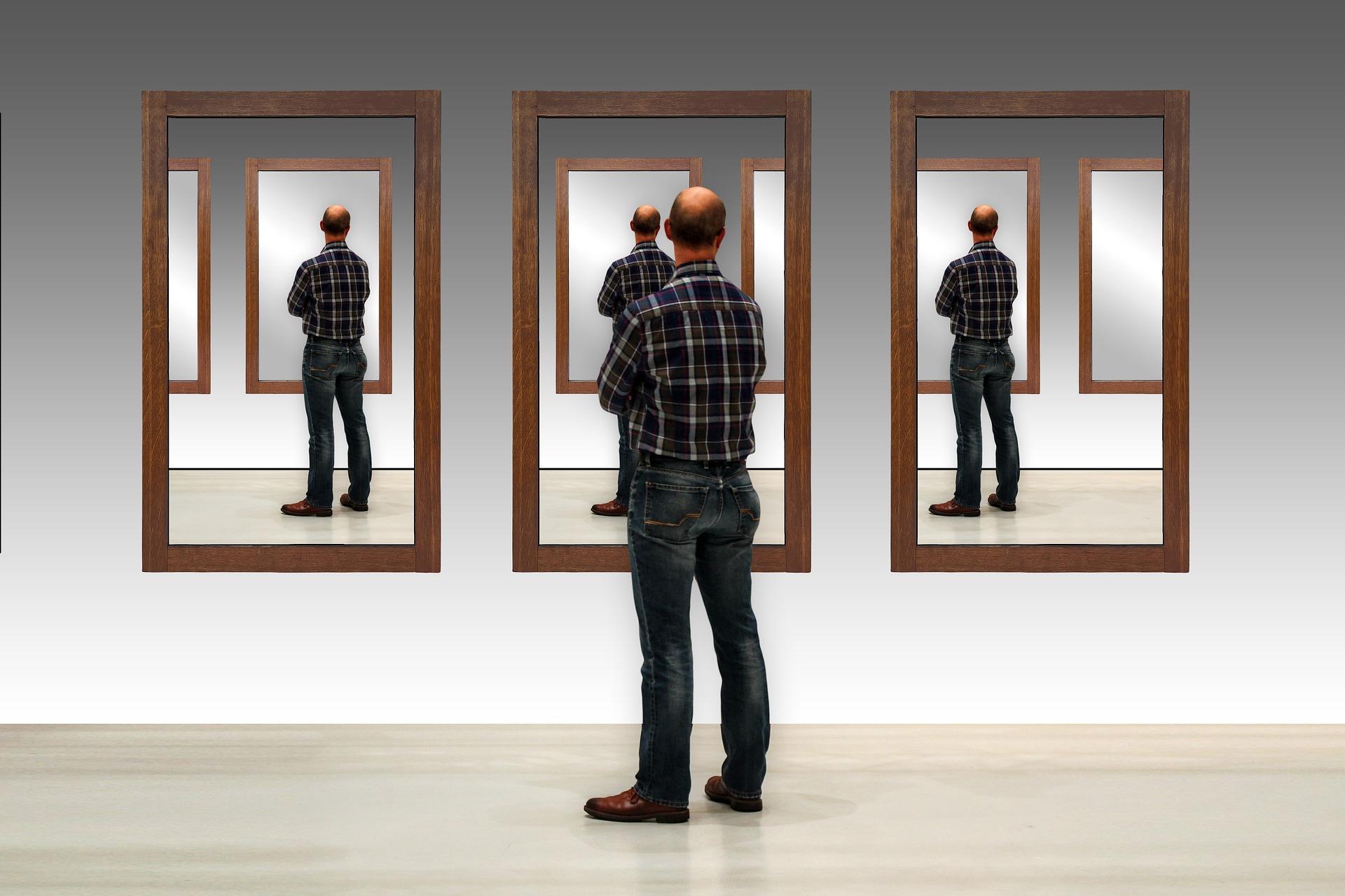 Multiple reflections of a man in mirror to represent multiple and duplicate data records